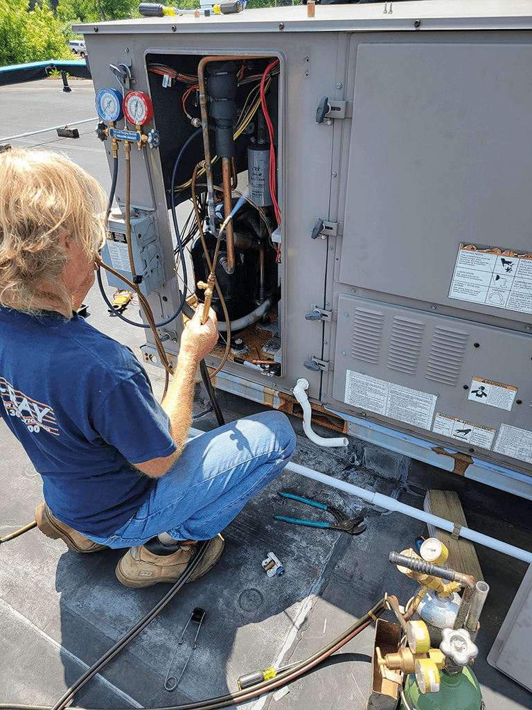 Installer working on HVAC system